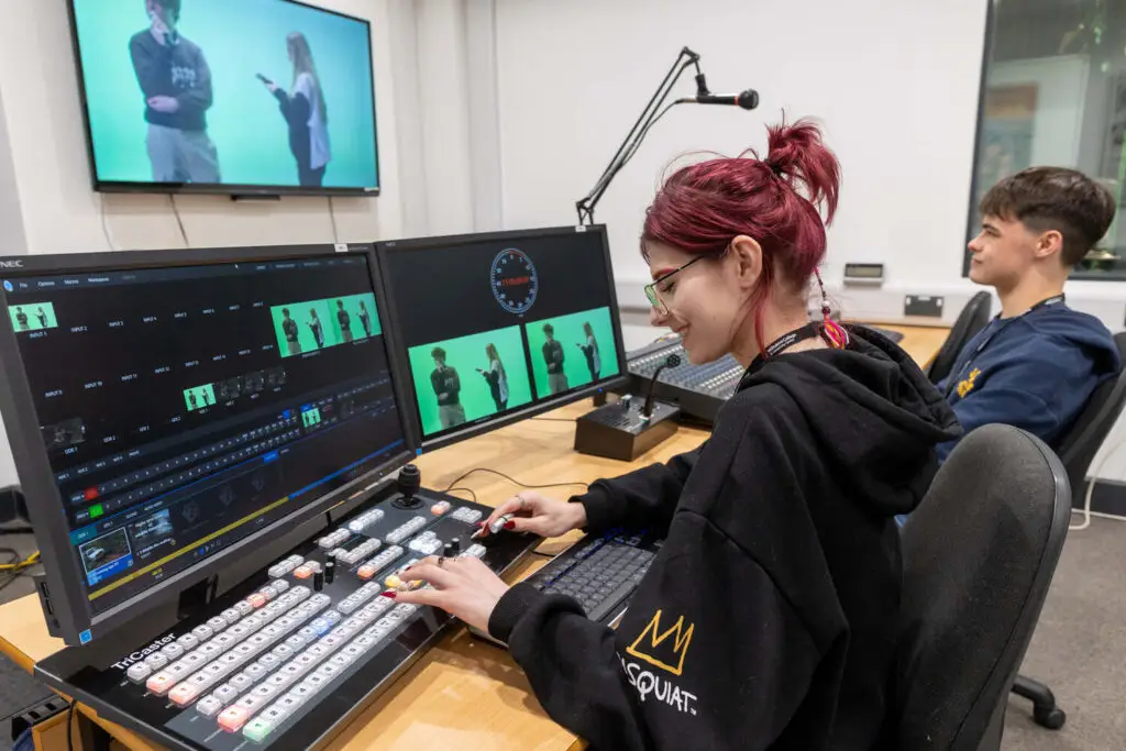 film and media production student editing video