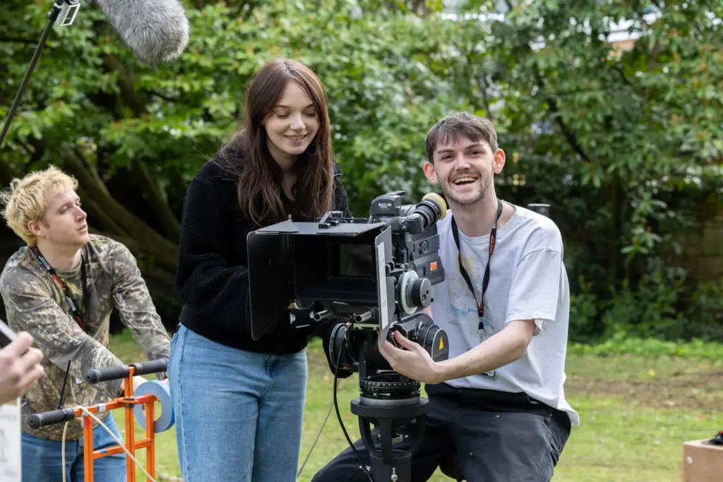 film and media production students behind a camera
