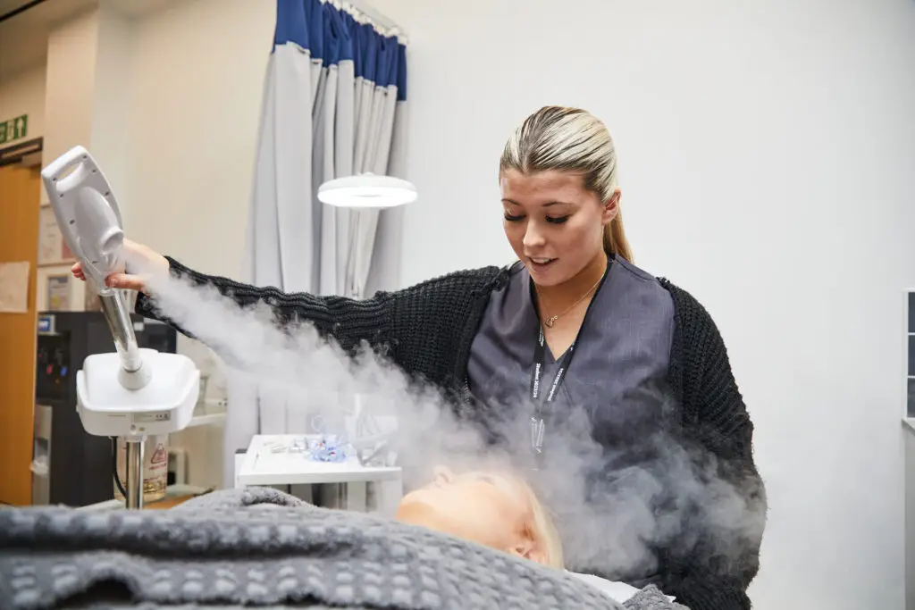 hair and beauty student steaming womens face