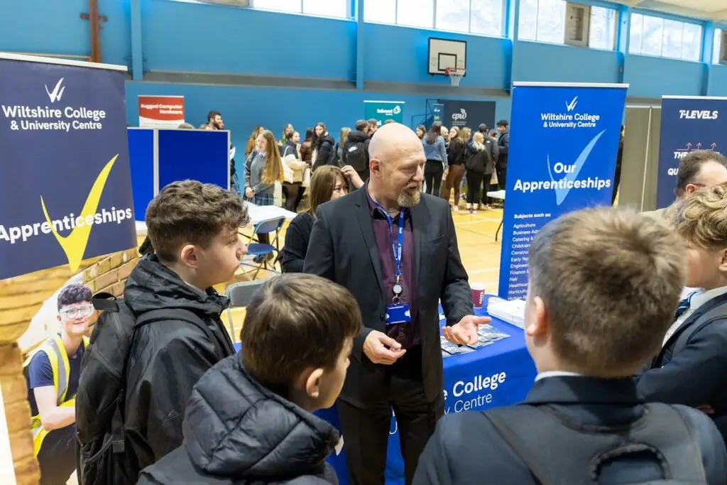 Business Development team member speaking to students at Appren-T-Fest event