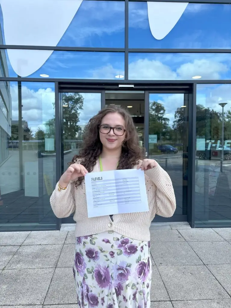 Business student Ruby Martin holding her successful T Level results