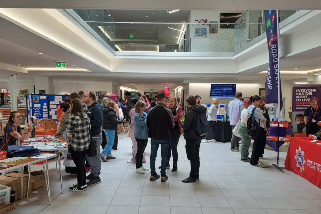 Students visiting stalls and talking to organisations at the Freshers Fair 2024 at Salisbury campus.