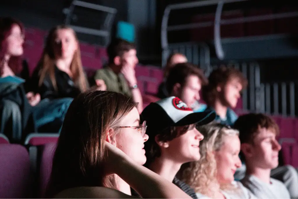 Students and guests in the audience watching a film screening.