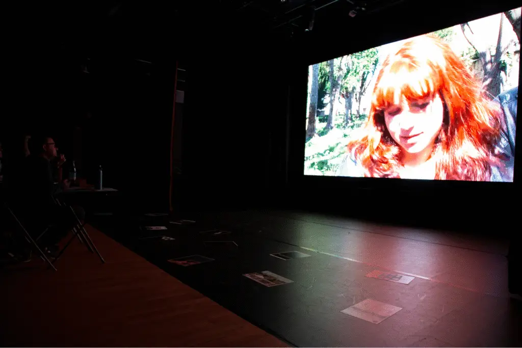 A student film projected on a large cinema screen at The Arc Theatre.