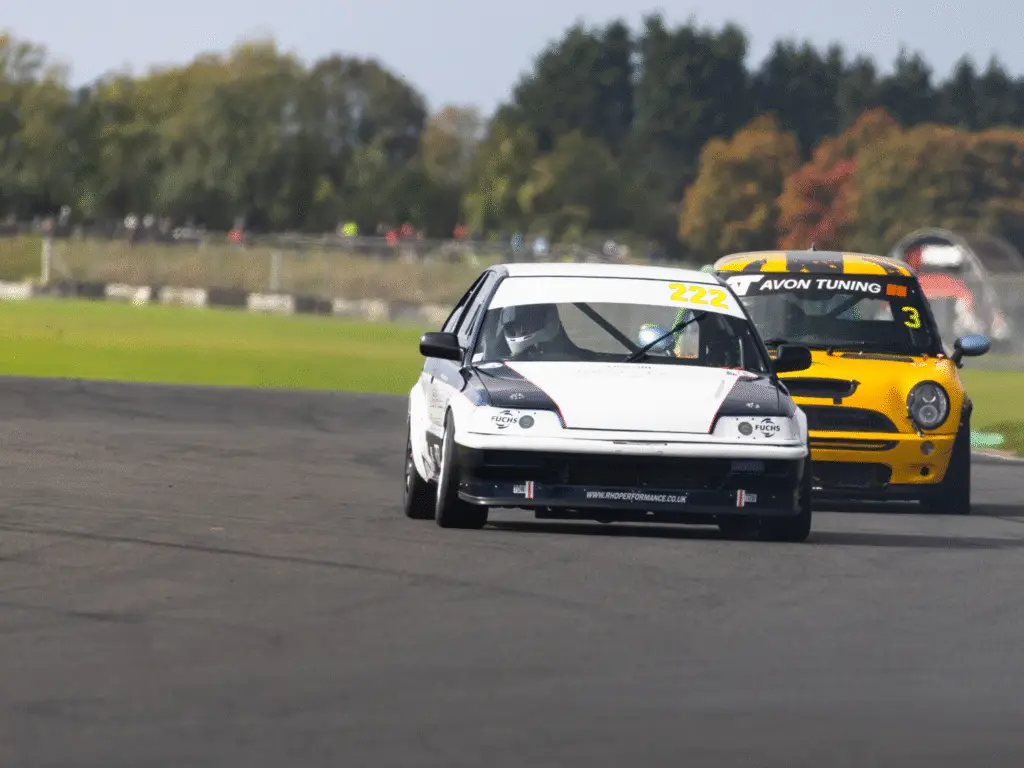 Two cars racing in championship at Castle Combe
