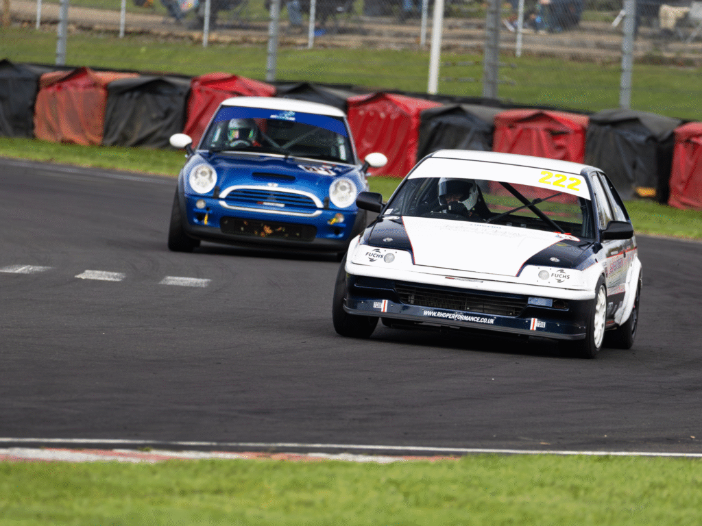 Two cars racing in championship at Castle Combe