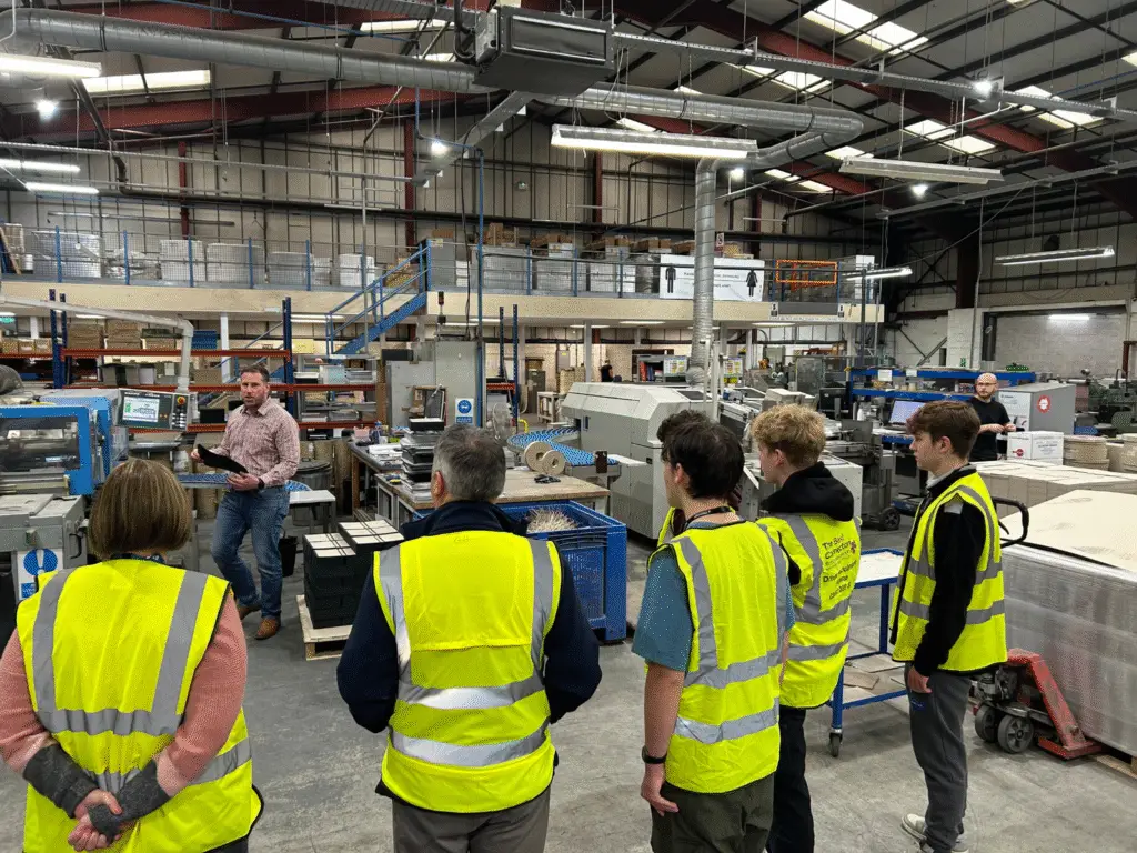 Engineering students from Wiltshire College & University Centre listen to a talk during a tour of CPI Antony Rowe printworks in Melksham.