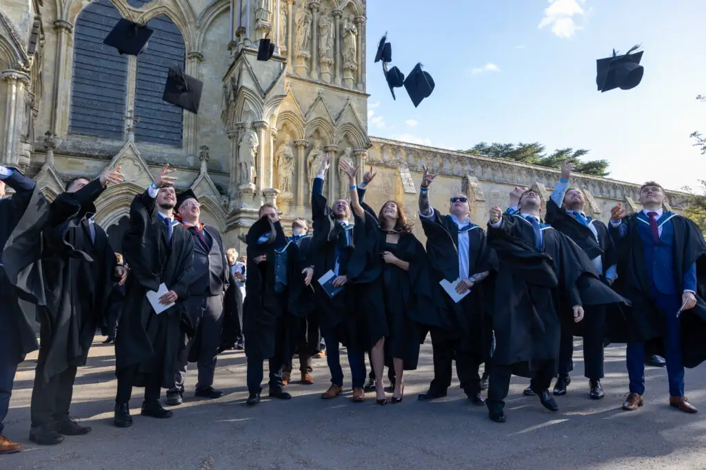 Graduates throwing caps