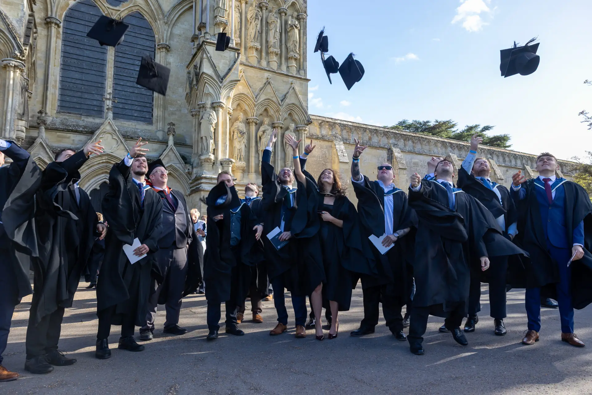 Graduates throwing caps