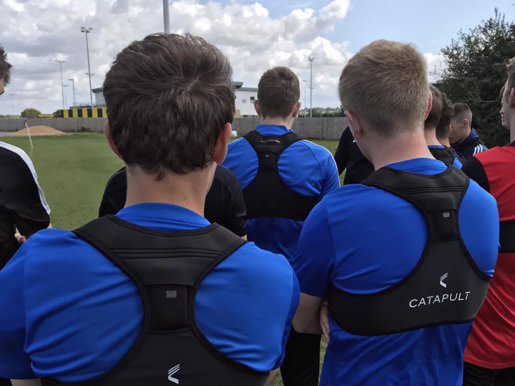 Wiltshire College football academy players wearing GPS vests during a training session.
