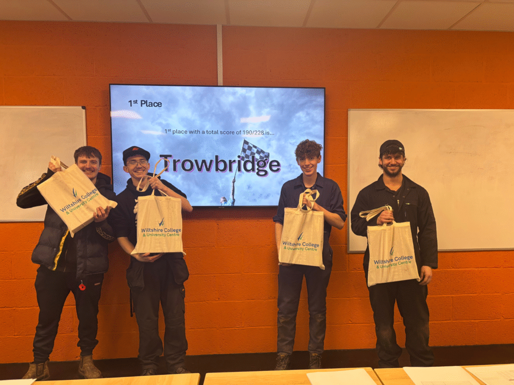 Trowbridge automotive students holding prizes after winning the skills competition.