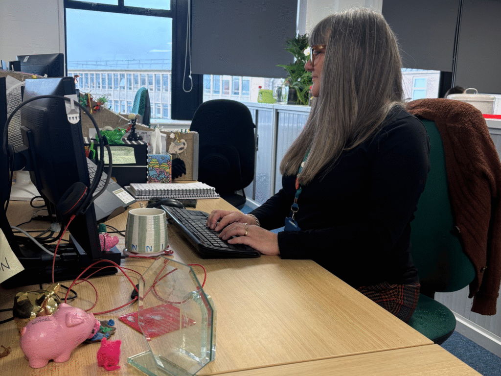 Ronnie Cross working at her desk at Wiltshire College’s Trowbridge campus