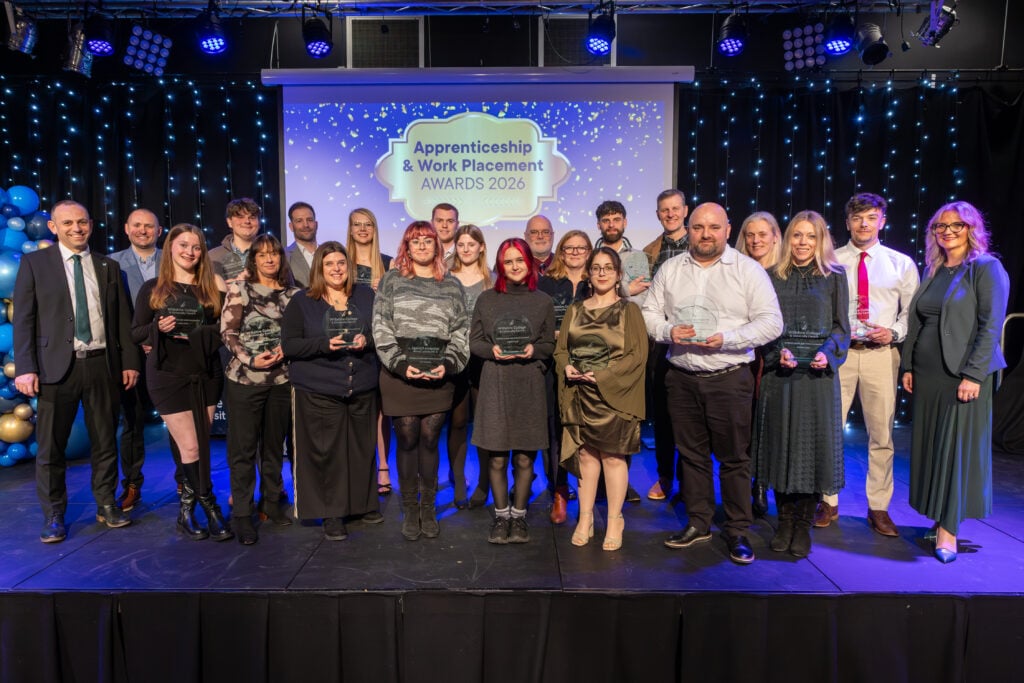 Apprentices, students and employers on stage at Wiltshire College & University Centre’s Apprenticeship and Work Placement Awards at Trowbridge Civic Centre.