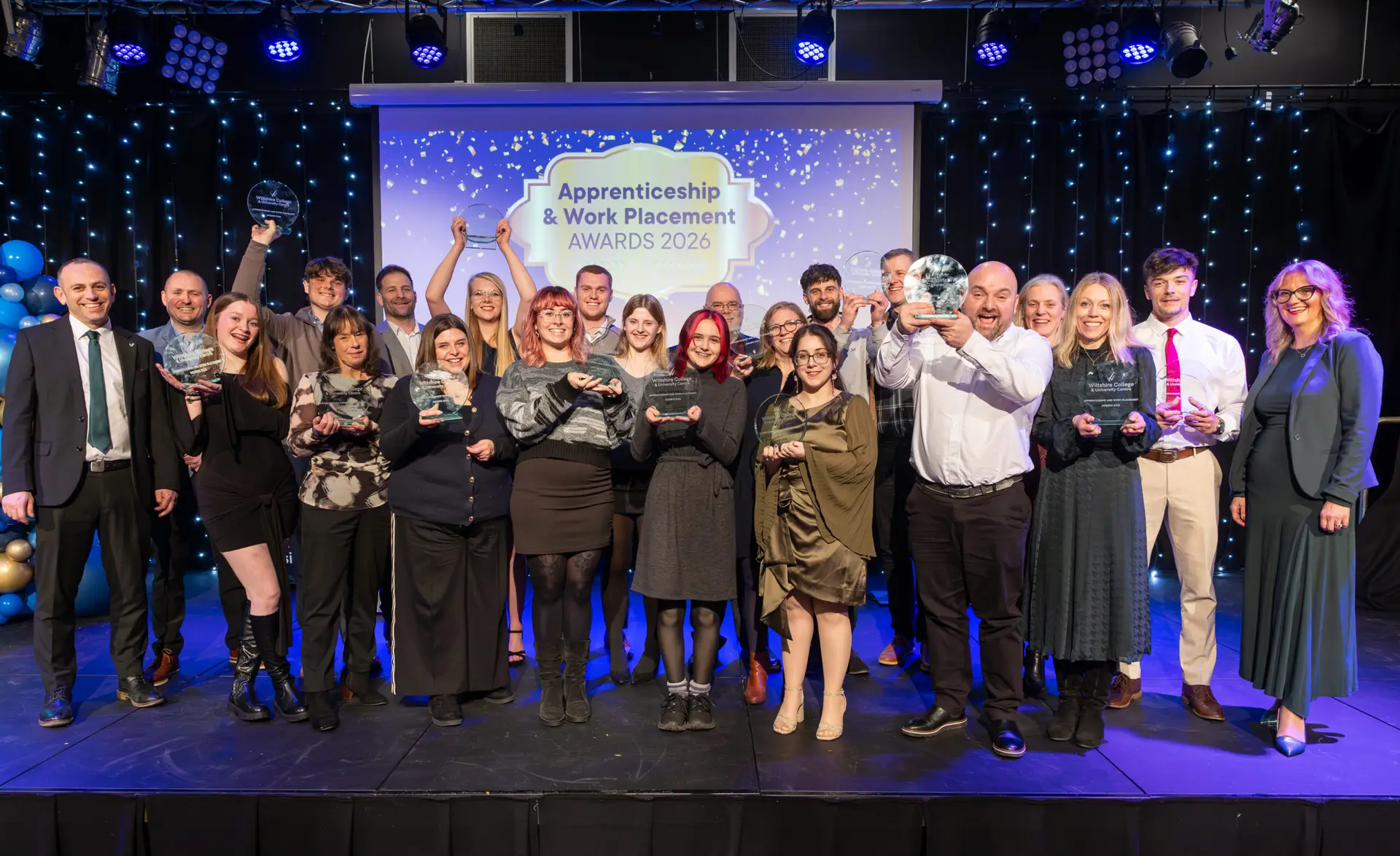 Apprentices, students and employers on stage at Wiltshire College & University Centre’s Apprenticeship and Work Placement Awards at Trowbridge Civic Centre.