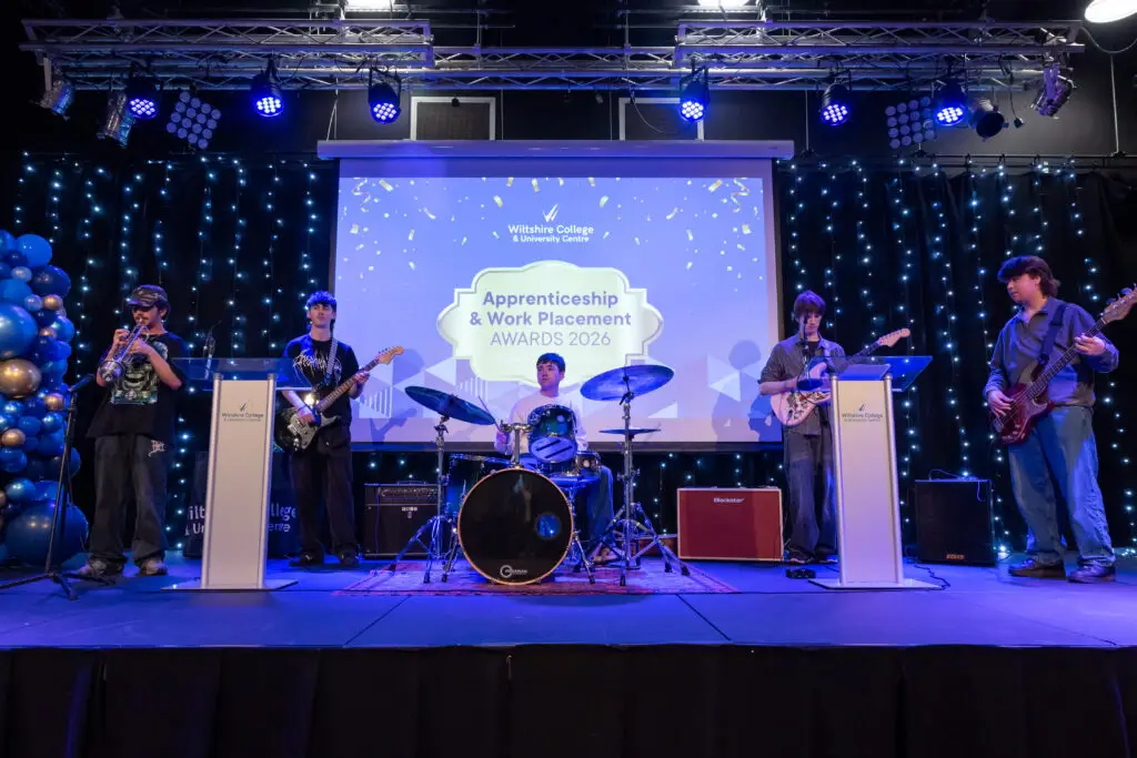 Apprentices, students and employers on stage at Wiltshire College & University Centre’s Apprenticeship and Work Placement Awards at Trowbridge Civic Centre.