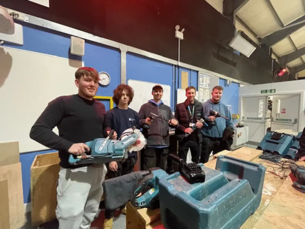 Group of apprentices attending a power tool and safety workshop