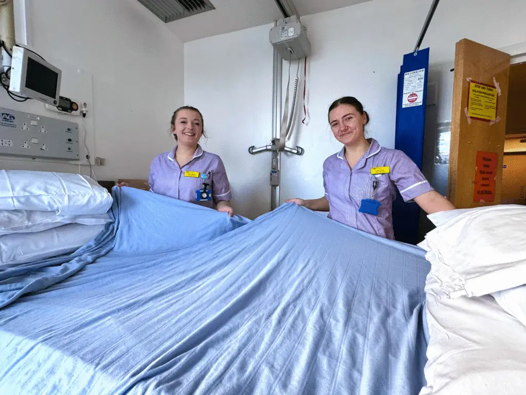 Students making beds on the spinal unit at Salisbury District Hospital