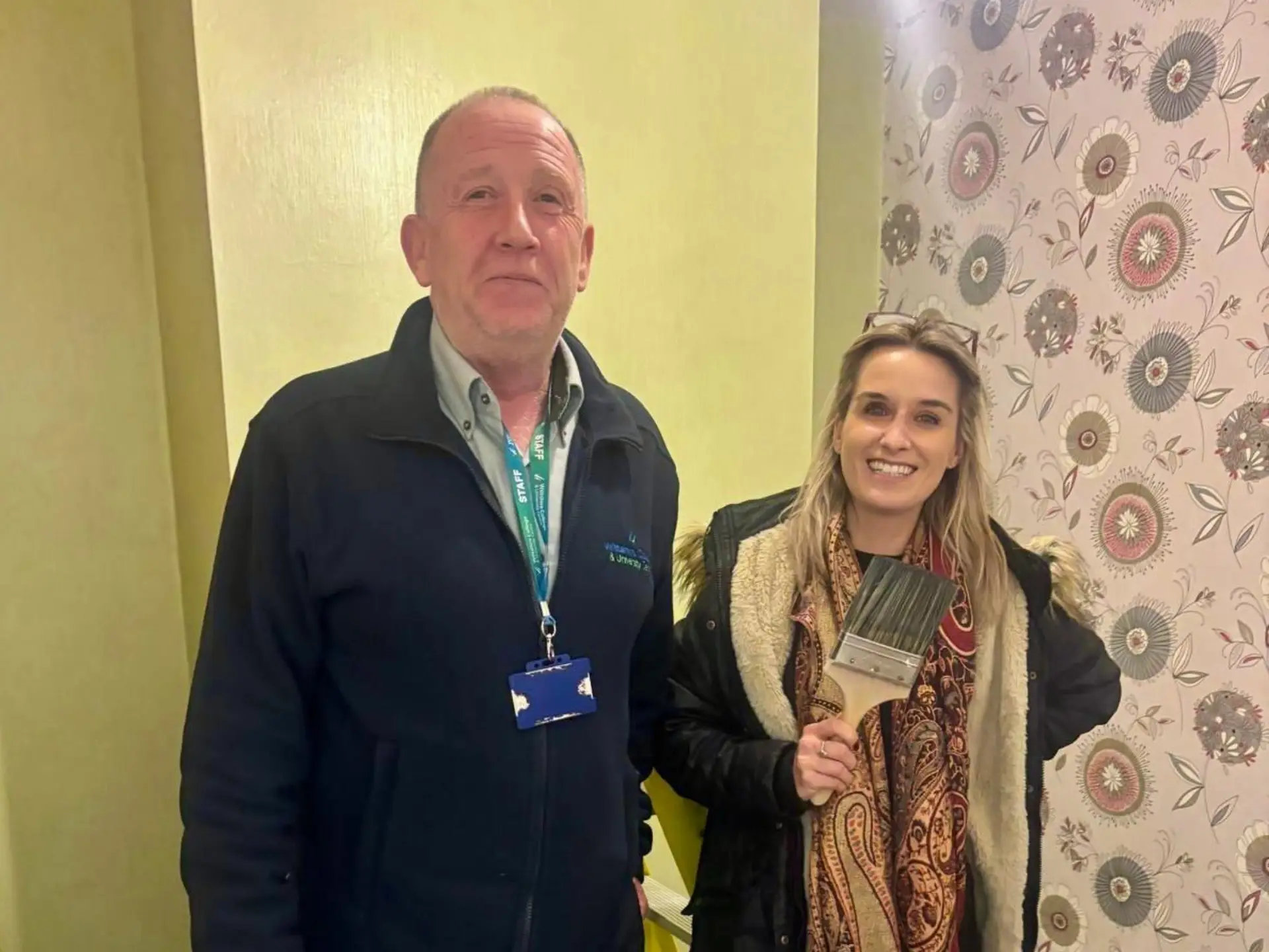 Two representatives from Wiltshire College & University Centre and Aster Group standing together at the Trowbridge campus during an employer visit to the construction workshops.
