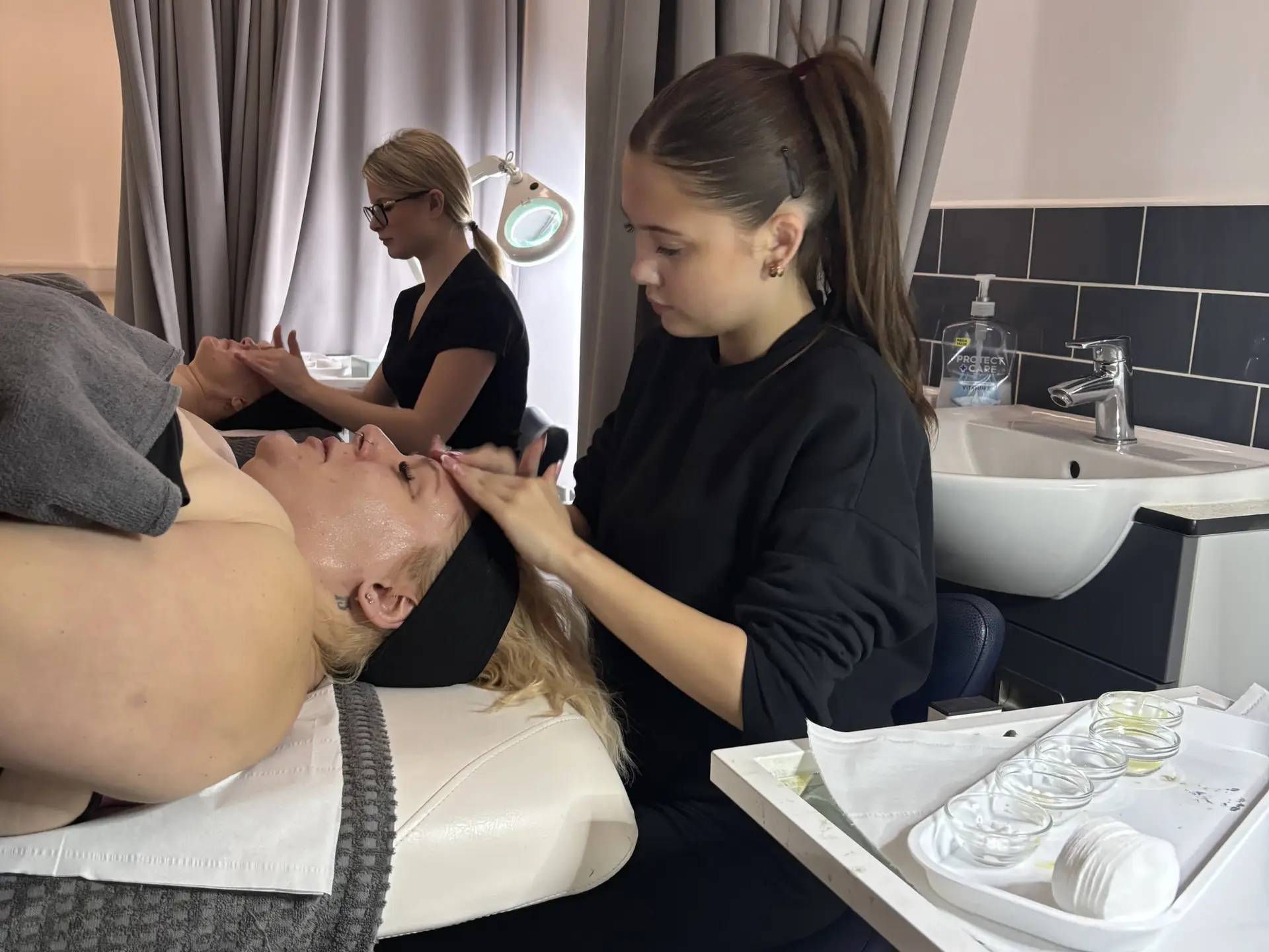 Students giving treatments to unpaid carers.