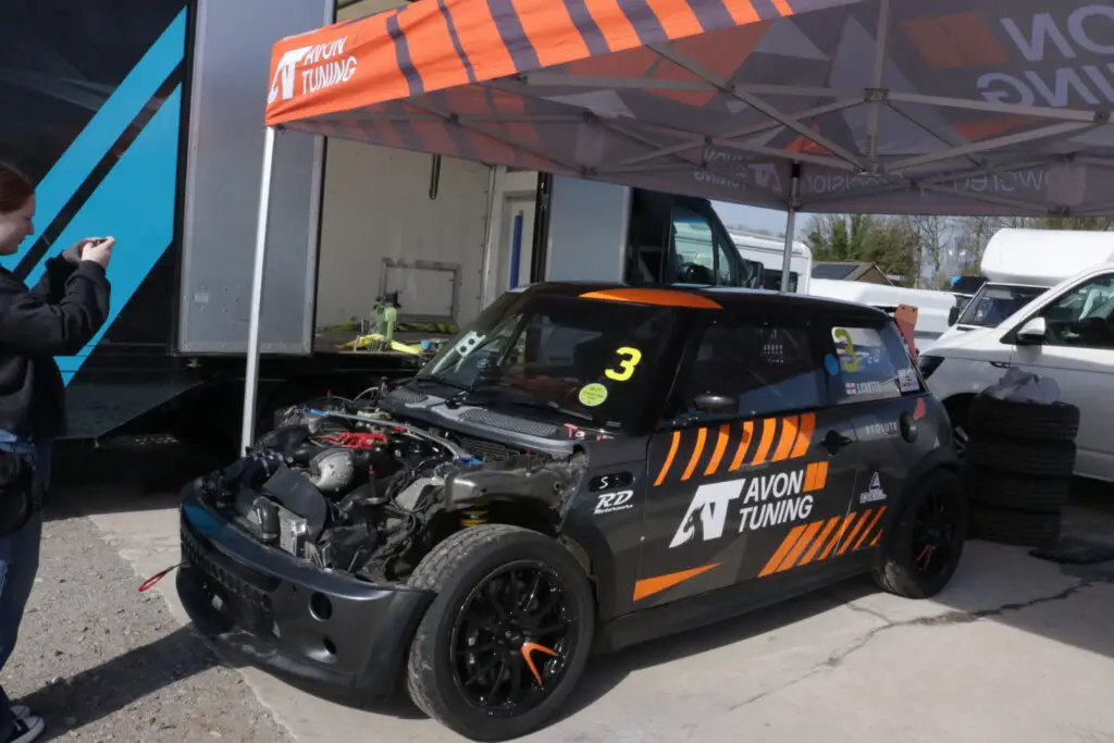 A black and orange mini ready for racing