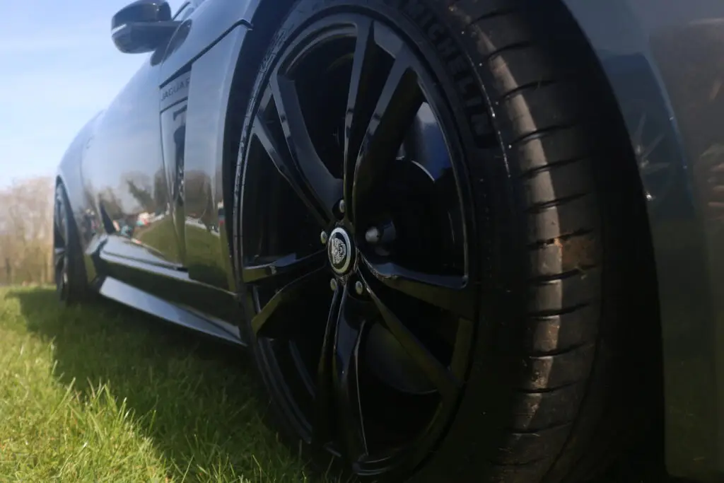A close up of a wheel of a car.