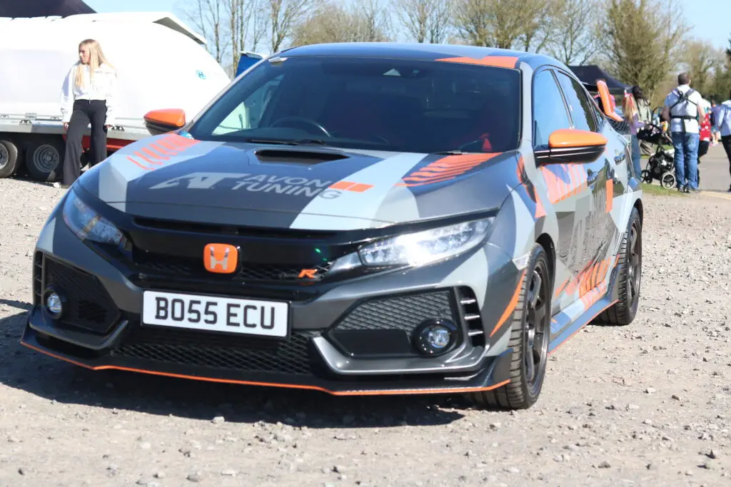 A grey and orange race car
