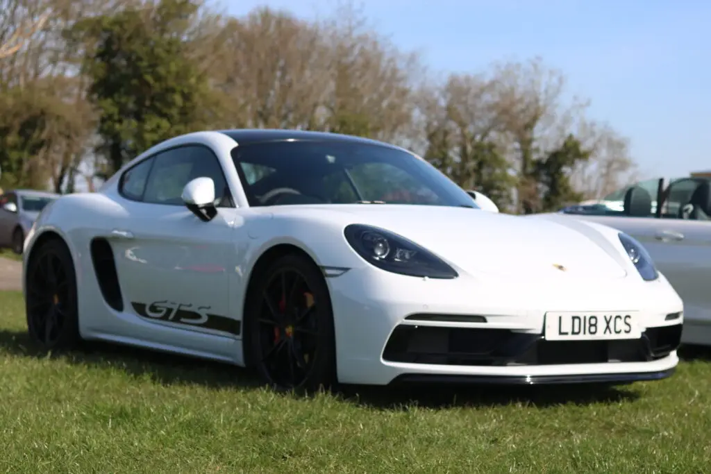 A white car parked on the grass