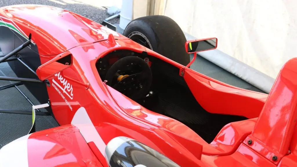 A close up of a red racing car