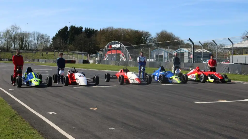 Cars lined up on track ready to go