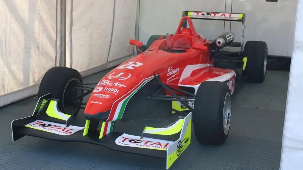 A red racing car in tent