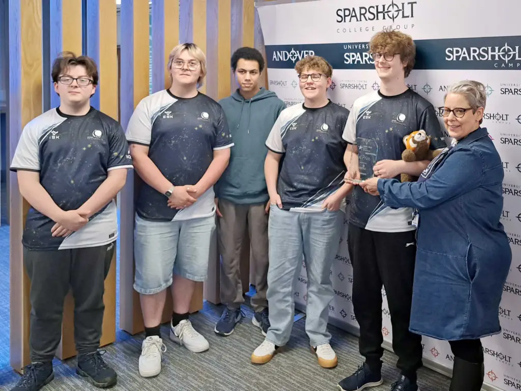 Group of esports students from Wiltshire College & University Centre stood together to celebrate their win