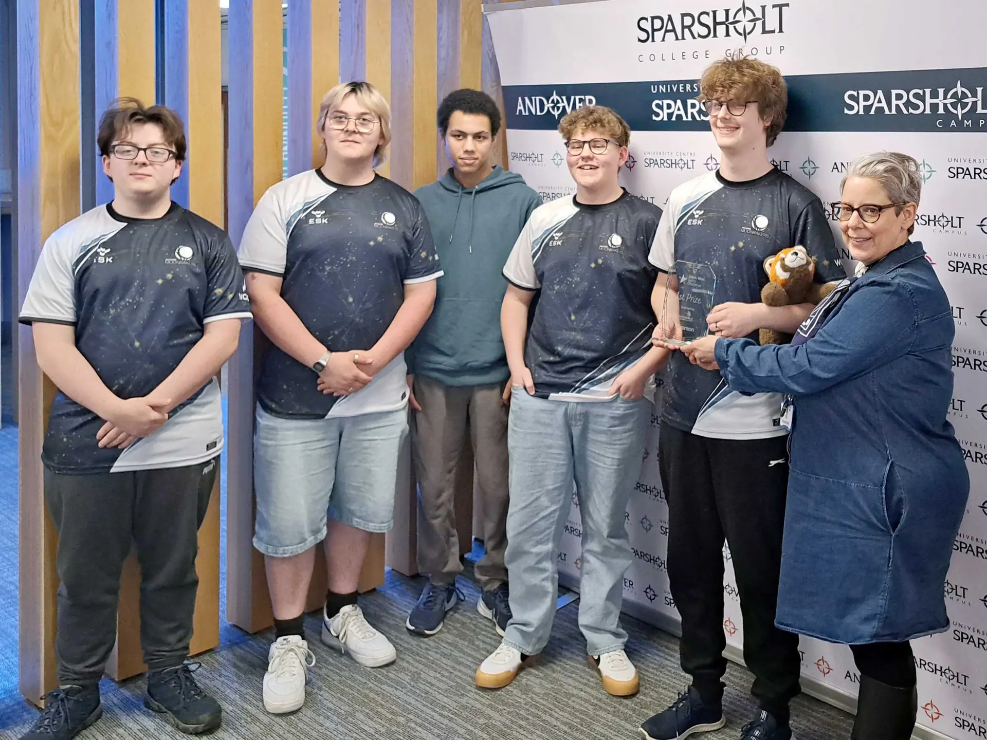 Group of esports students from Wiltshire College & University Centre stood together to celebrate their win