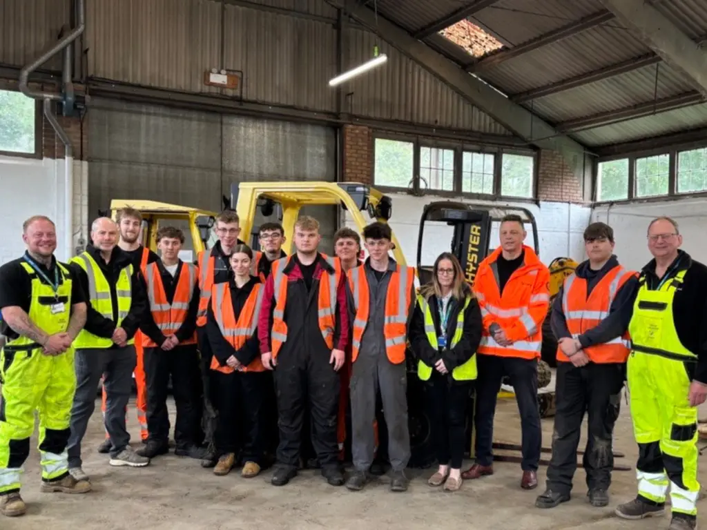 Students, lecturers and representatives from engineering company Amey stand together