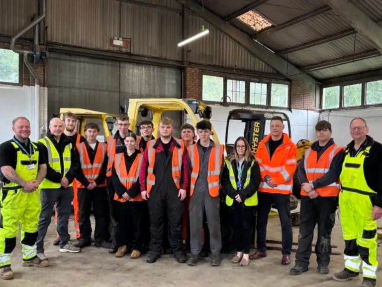 Students, lecturers and representatives from engineering company Amey stand together