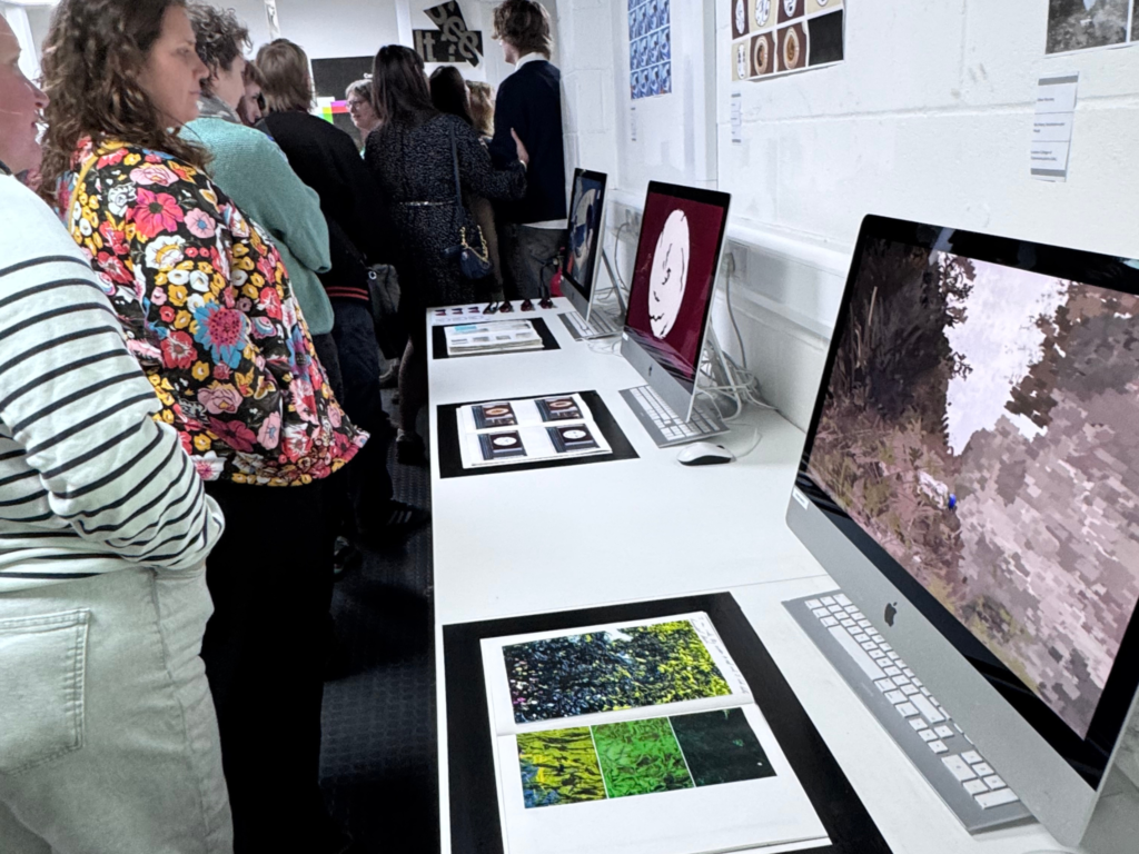 Visitors viewing student artwork and displays during the end-of-term creative exhibition at Wiltshire College & University Centre's Trowbridge campus.