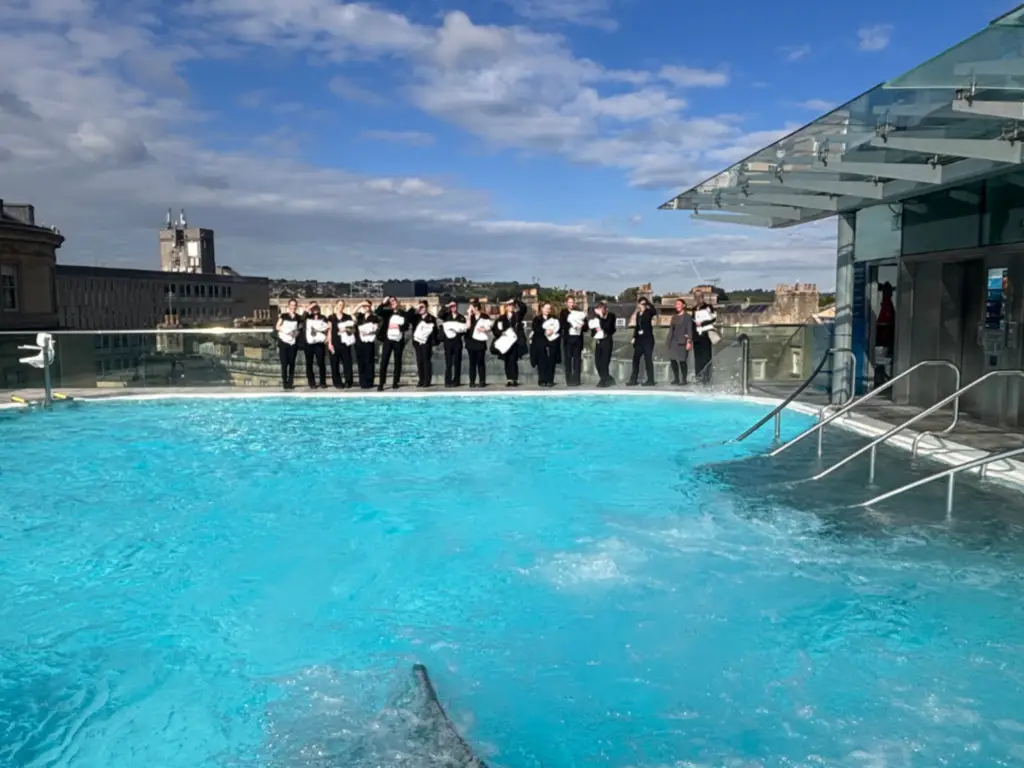 Students gathered at the rooftop pool at Therma Bath Spa 