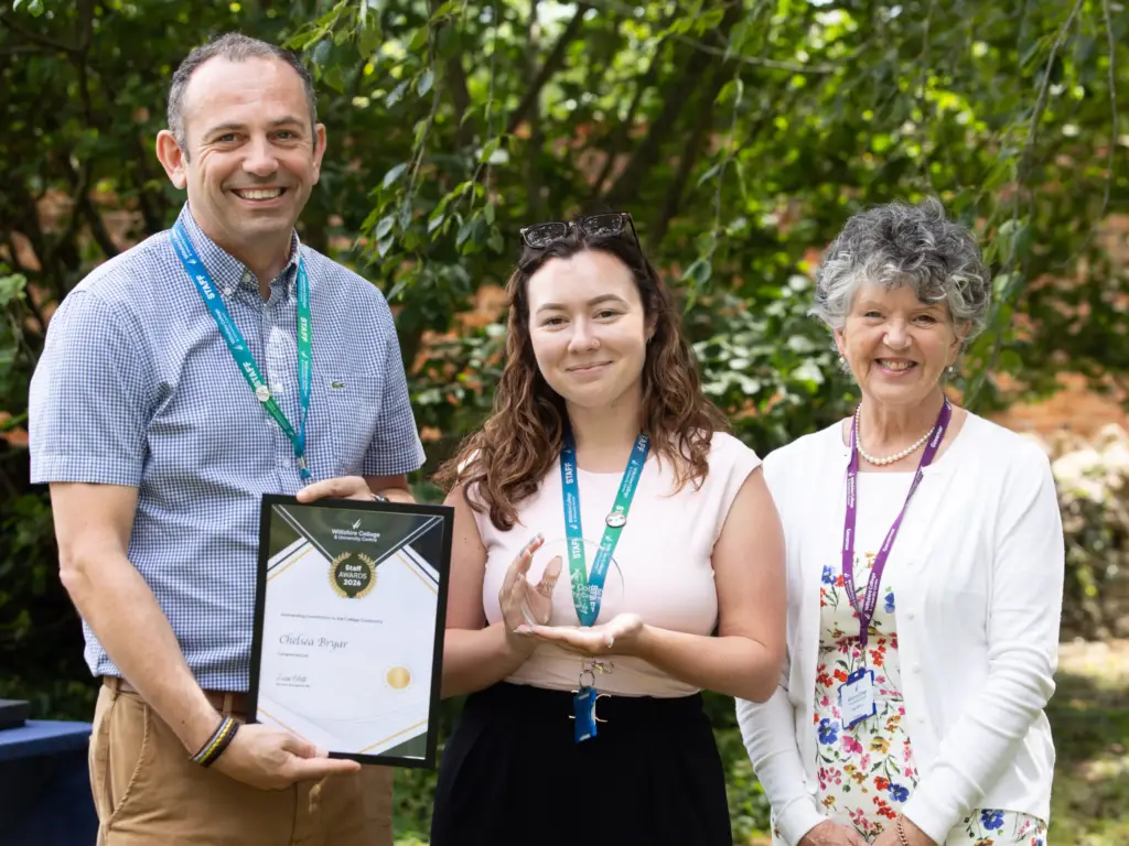 Staff member at Wiltshire College's annual staff awards being presented with an award