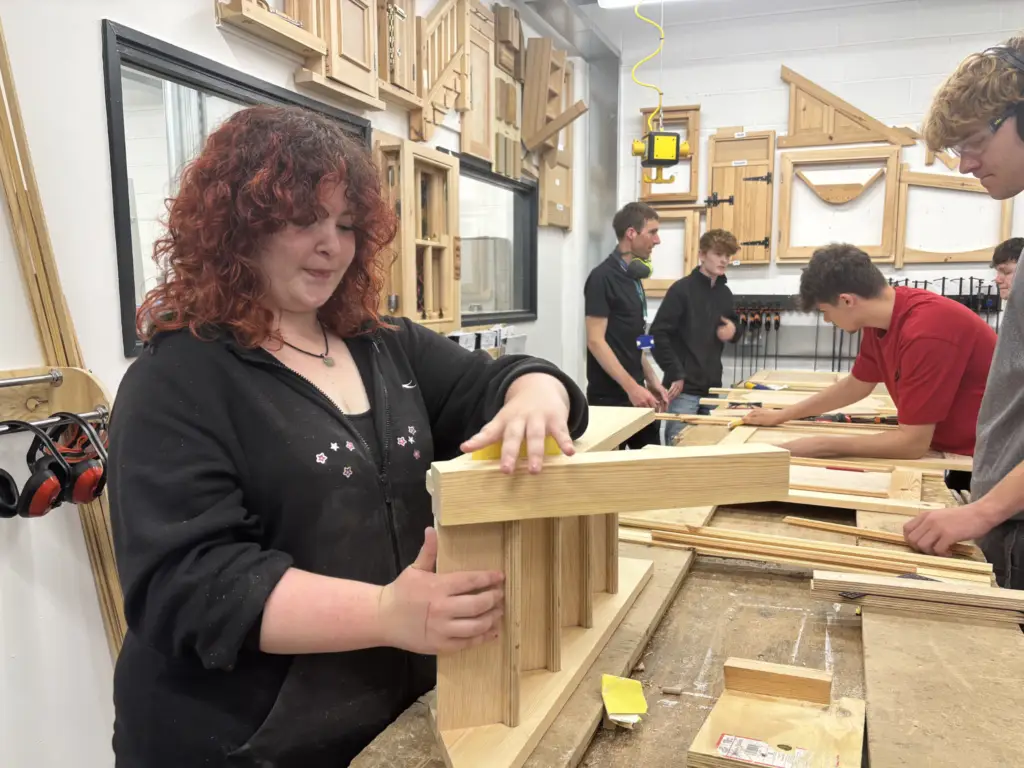 Female joinery student working during the College's Construction Skills Competition.