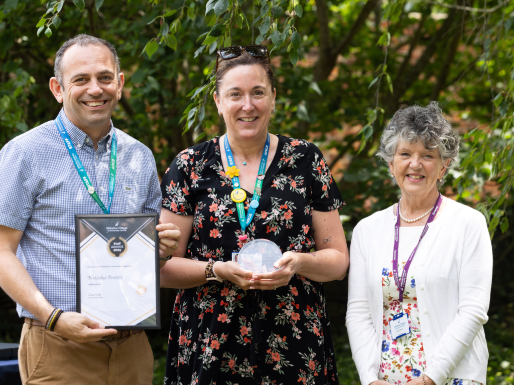 Staff member awarded a glass trophy and certificate for Outstanding Contribution to Student Experience