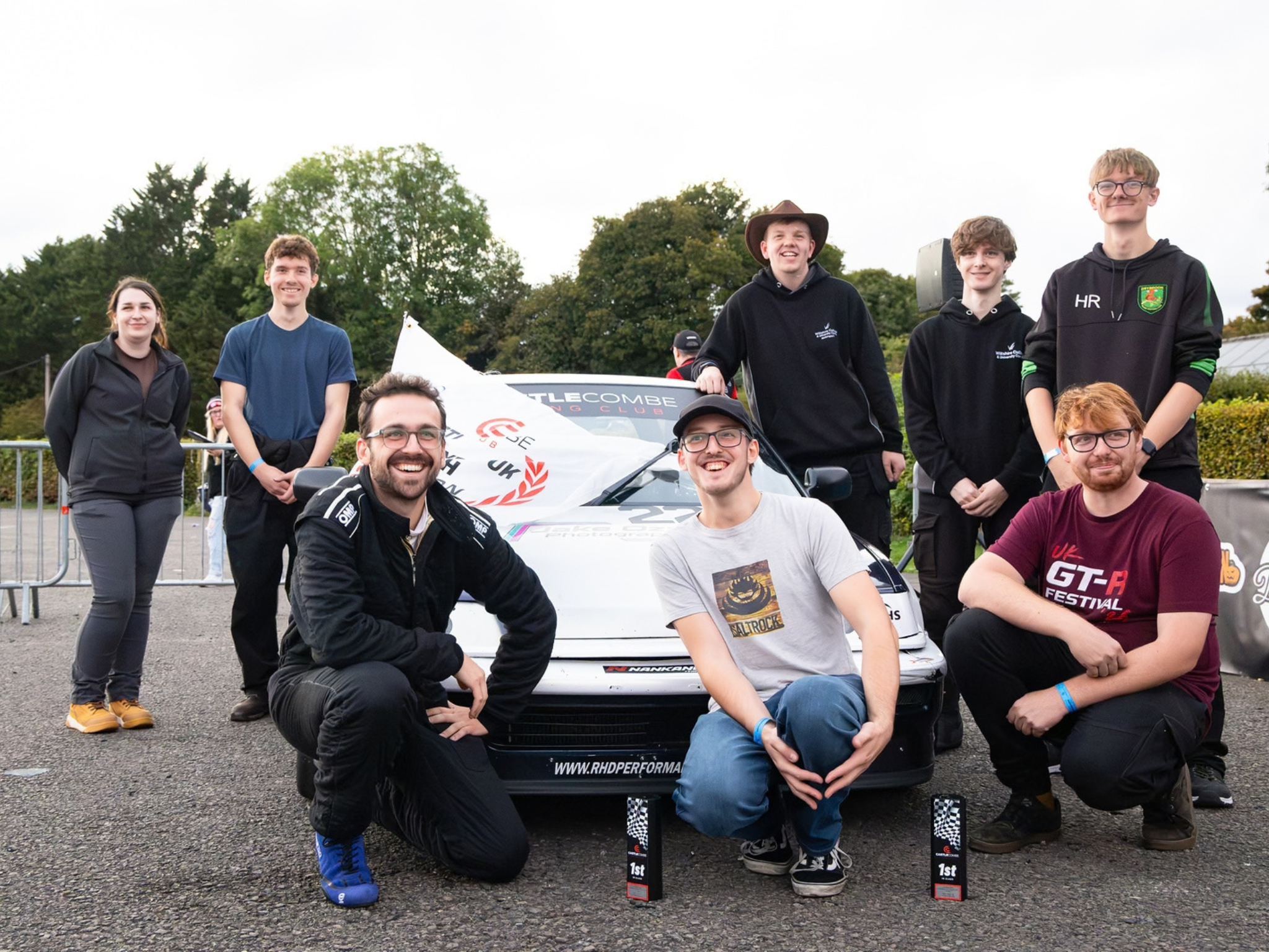 Sam and students at Castle Combe celebrating a second championship win