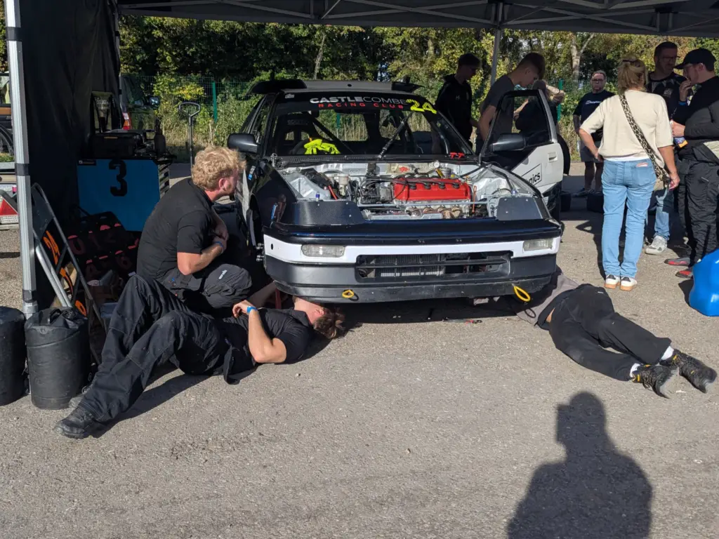 Students working on another Wiltshire College car at the Hot Hatch championships at Castle Combe