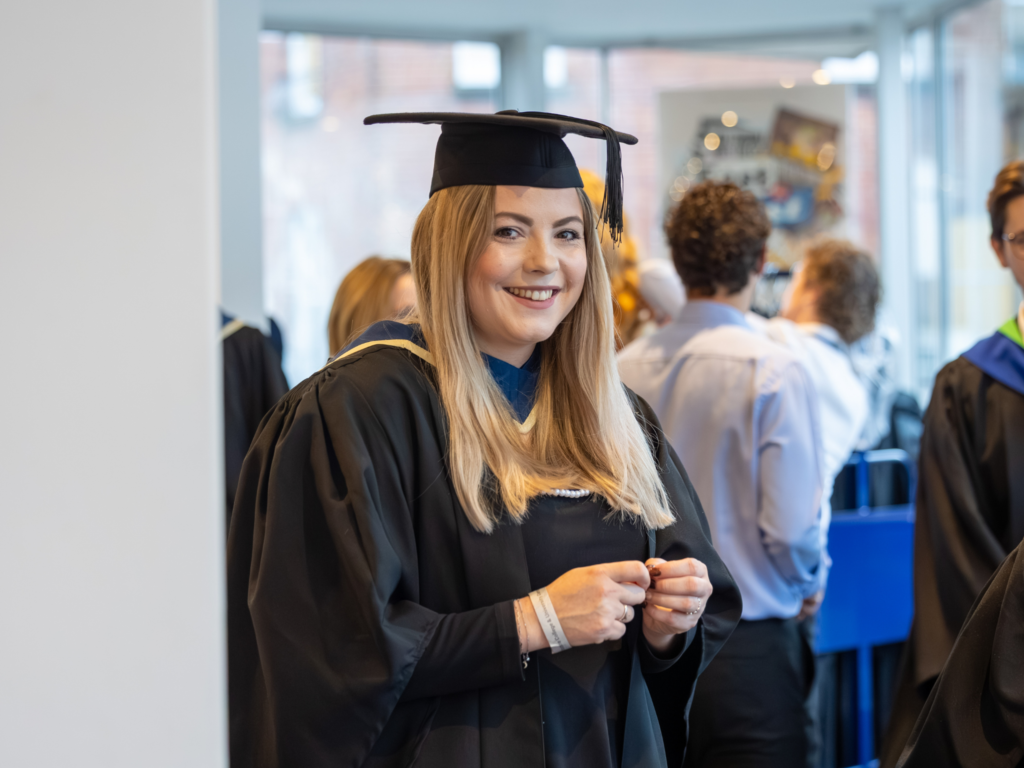 A graduand after getting her gown and cap 
