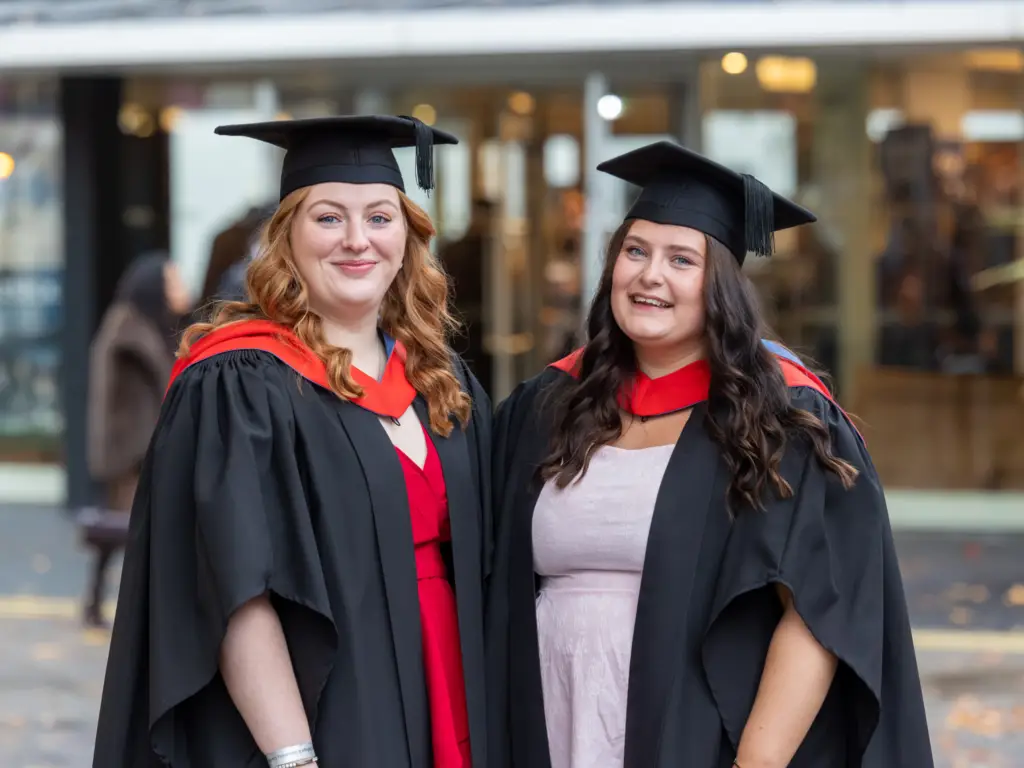 Two graduands stood next to each other 